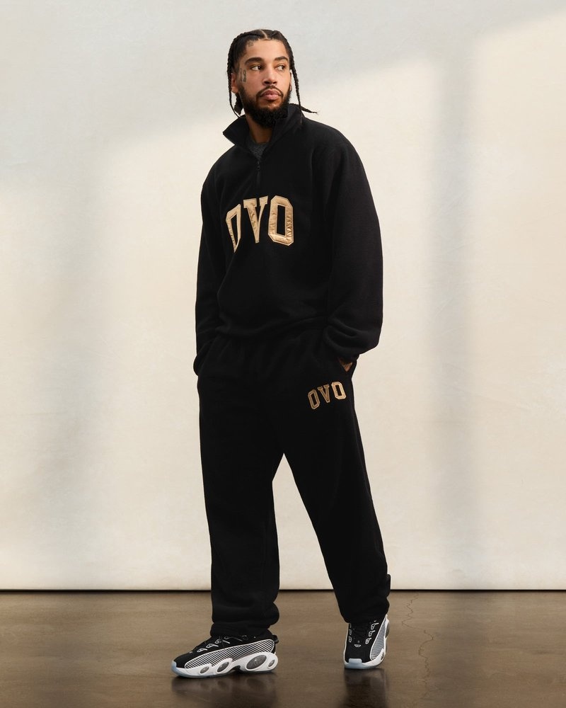 pantaloni della tuta con orlo aperto e logo ovo arch di october neri