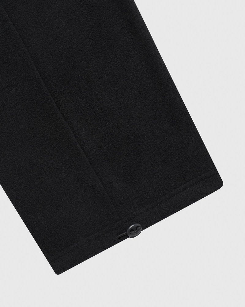 pantaloni della tuta con orlo aperto e logo ovo arch di october neri
